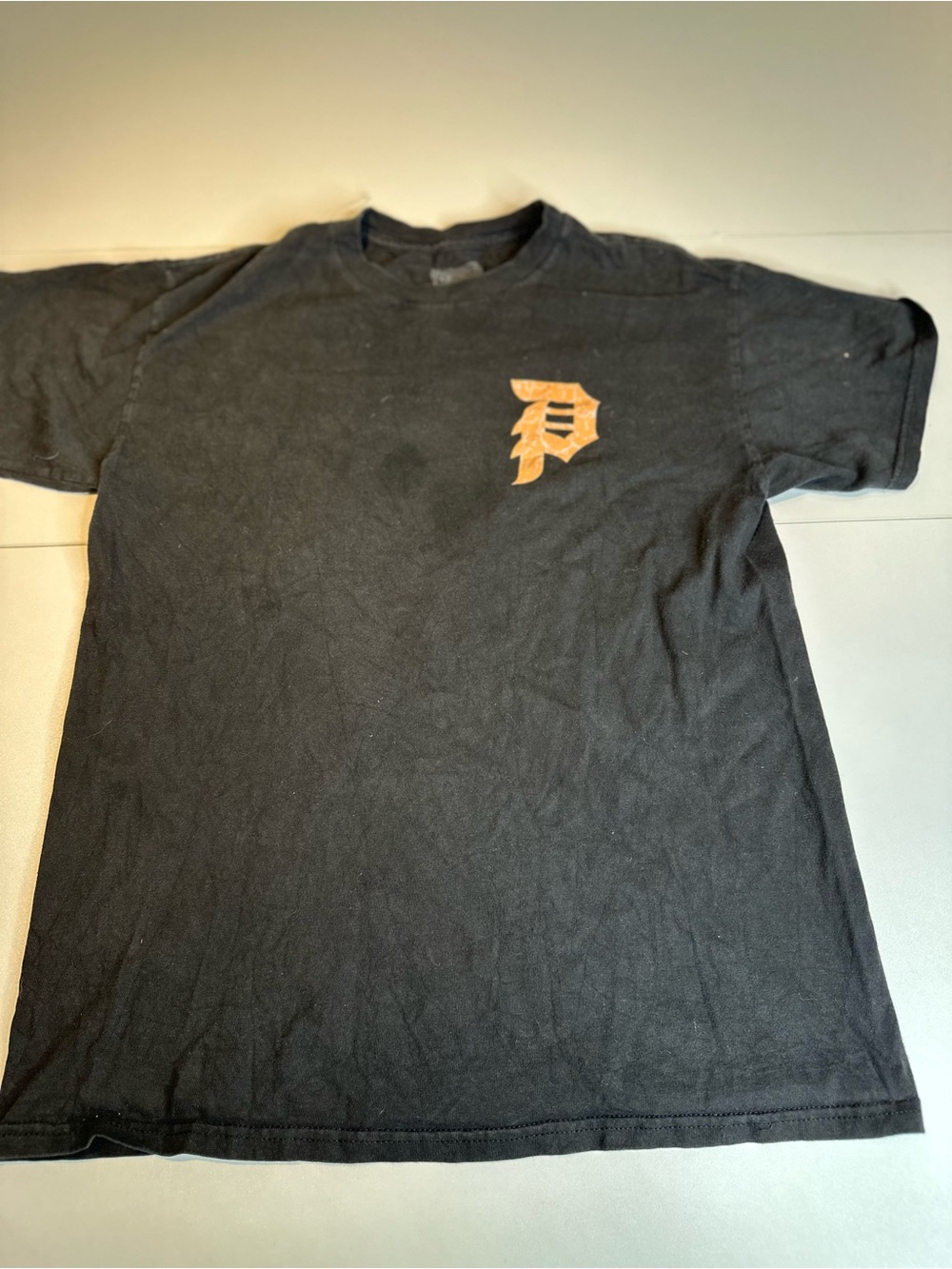 Primitive Black Naruto Graphic Tee with Orange Accent